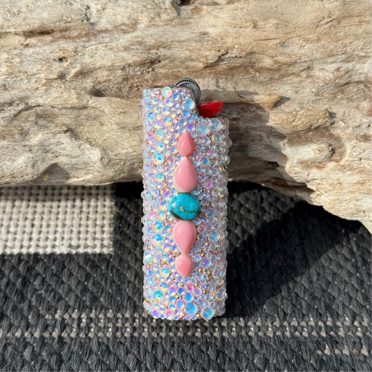 Decorative lighter with colorful beads on a textured surface
