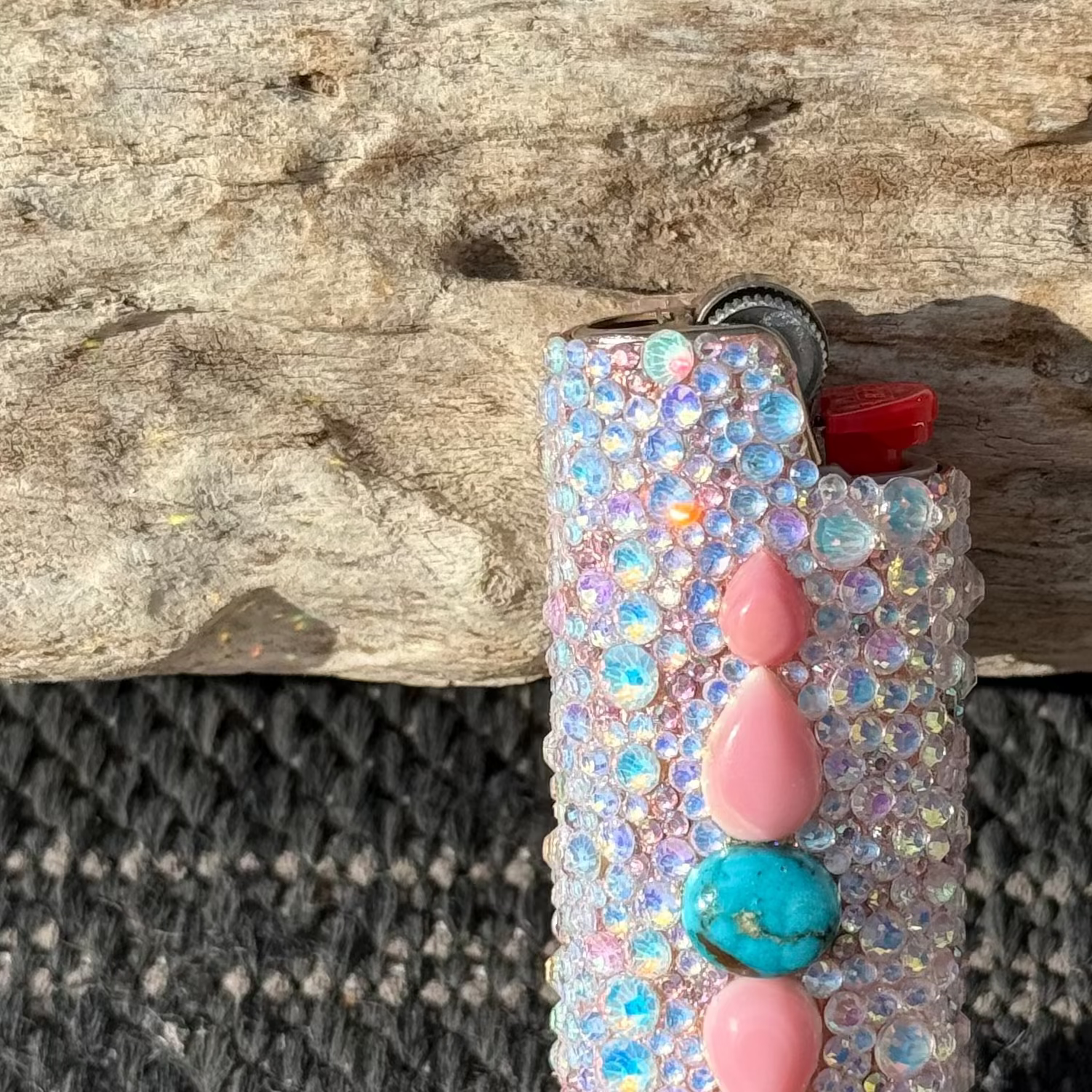 Decorative lip balm with beads on a wooden surface