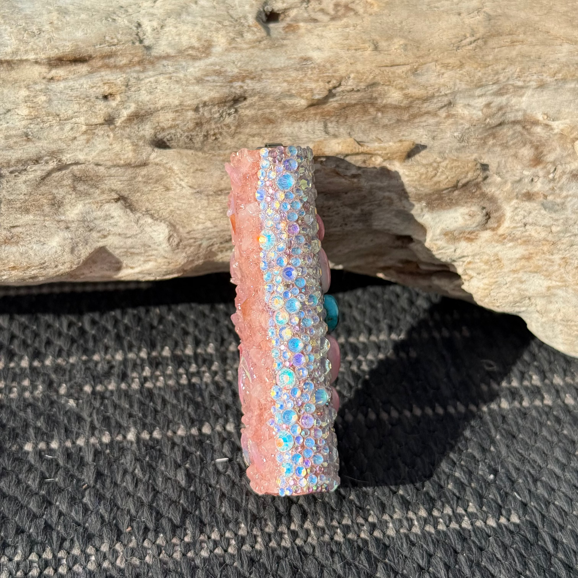 Decorative object with glittery design on a wooden surface